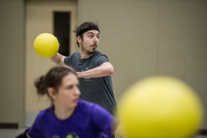 Person about to throw a dodgeball at the free drop-in games