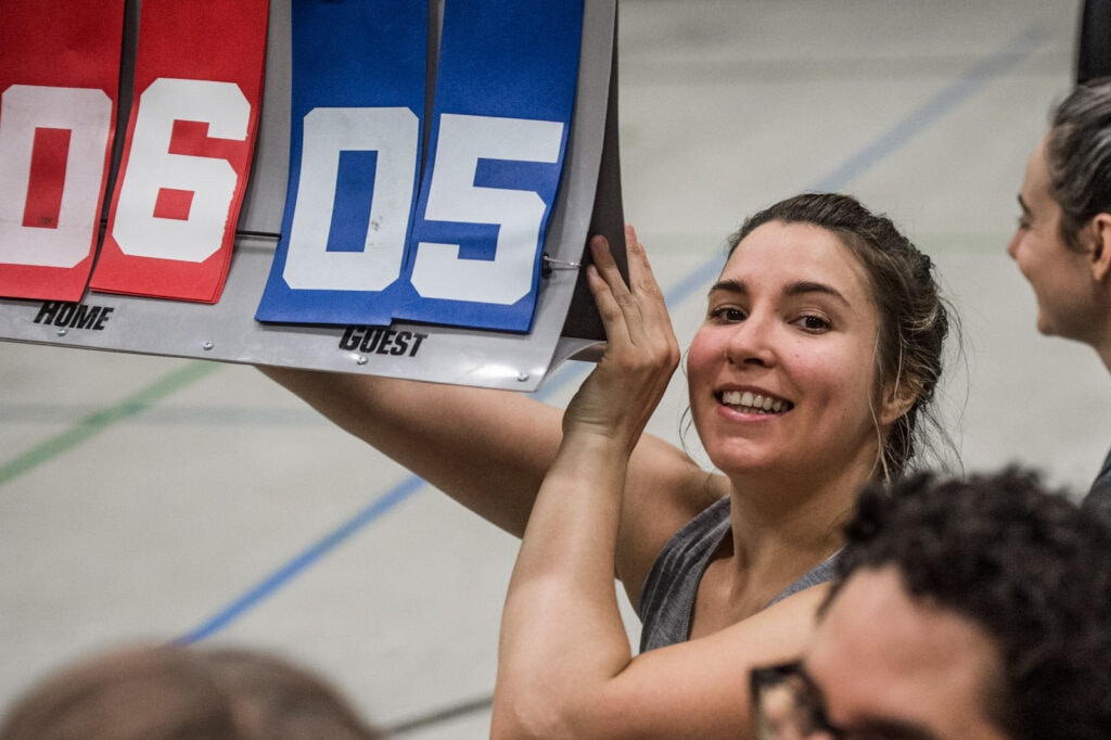 Woman holds scoreboard