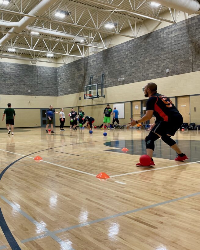 A dodgeball player practices a drill at a dodgeball skills clinic.